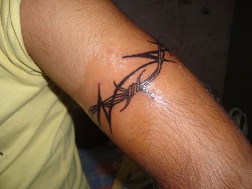Awesome Black Tribal And Barbed Wire Tattoo On Left Bicep